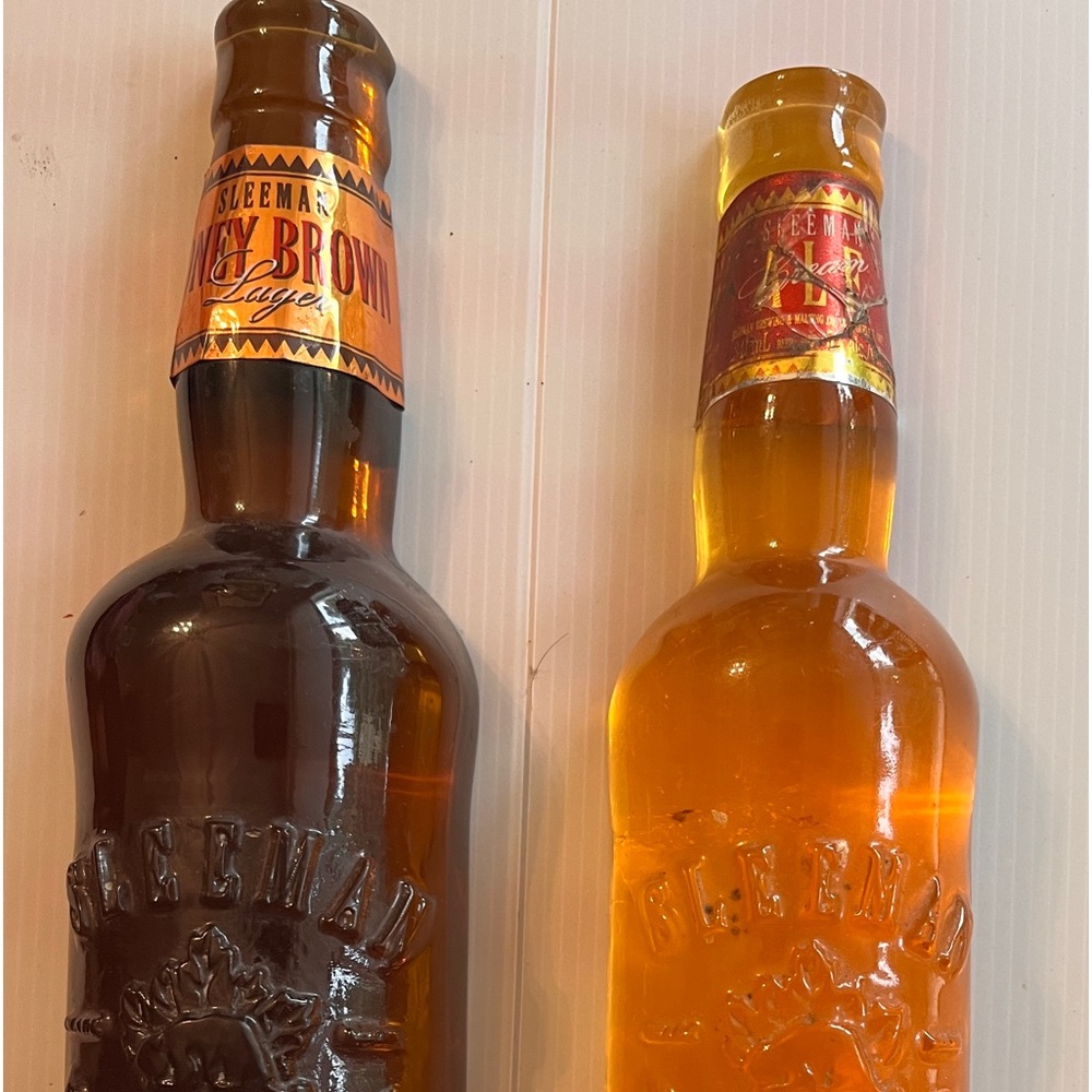 Two sleemans beer toppers.